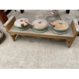 A WOODEN STAND WITH THREE CERAMIC SERVING POTS