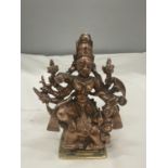 A HEAVY BRASS AND COPPER MODEL OF THE GOD DURGA HEIGHT 13 CM