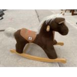 A PLUSH CHILDRENS ROCKING HORSE