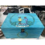 A HAND PAINTED MEMORY BOX 'OUR FIRST BABY' WIDTH 35CM, HEIGHT 17CM, DEPTH 25CM