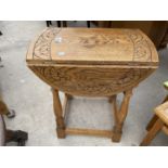 A MINIATURE OAK OVAL DROP-LEAF TABLE, 23X18" OPENED