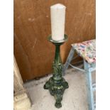 A VINTAGE HEAVY CAST IRON CANDLESTICK WITH LION PAW FEET (H:68CM)