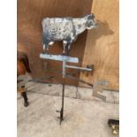 A VINTAGE METAL WEATHER VANE WITH COW TOPPER