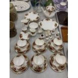 A ROYAL ALBERT 'COUNTRY ROSES' TEASET TO INCLUDE A TEAPOT, SIX TRIOS, CREAM JUGS, SUGAR BOWL -