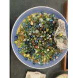 A LARGE BOWL CONTAINING A QUANTITY OF VINTAGE GLASS MARBLES