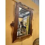 A LARGE PINE FRAMED MIRROR APPROXIMATELY 106CM X 70CM