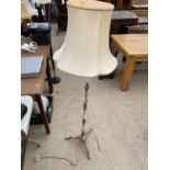 A BRASS AND ONYX STANDARD LAMP WITH SHADE