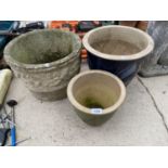 A RECONSTITUTED STONE GARDEN PLANTER AND TWO GLAZED PLANTERS