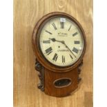 A VINTAGE OAK CASED WALL CLOCK BEARING THE NAME 'W M FISH 6 PRUSSIA ST. LIVERPOOL'