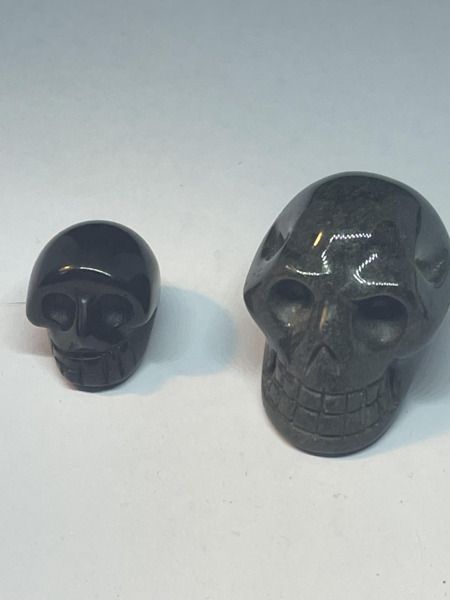 TWO CARVED AGATE STONE SKULLS