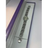 A SILVER ROTARY WRIST WATCH WITH A PEARLISED FACE IN A PRESENTATION BOX