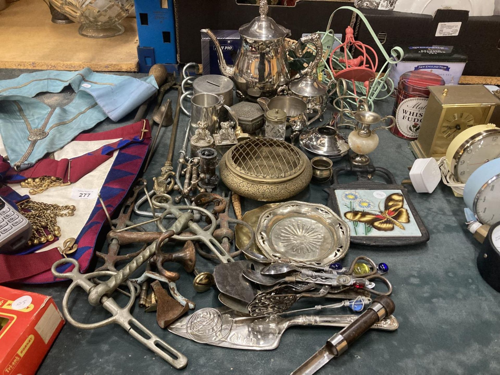 A LARGE QUANTITY OF ITEMS TO INCLUDE A SILVER PLATED TEASET, FLATWARE, HORSE BITS, BOWLS, MONEY BOX,
