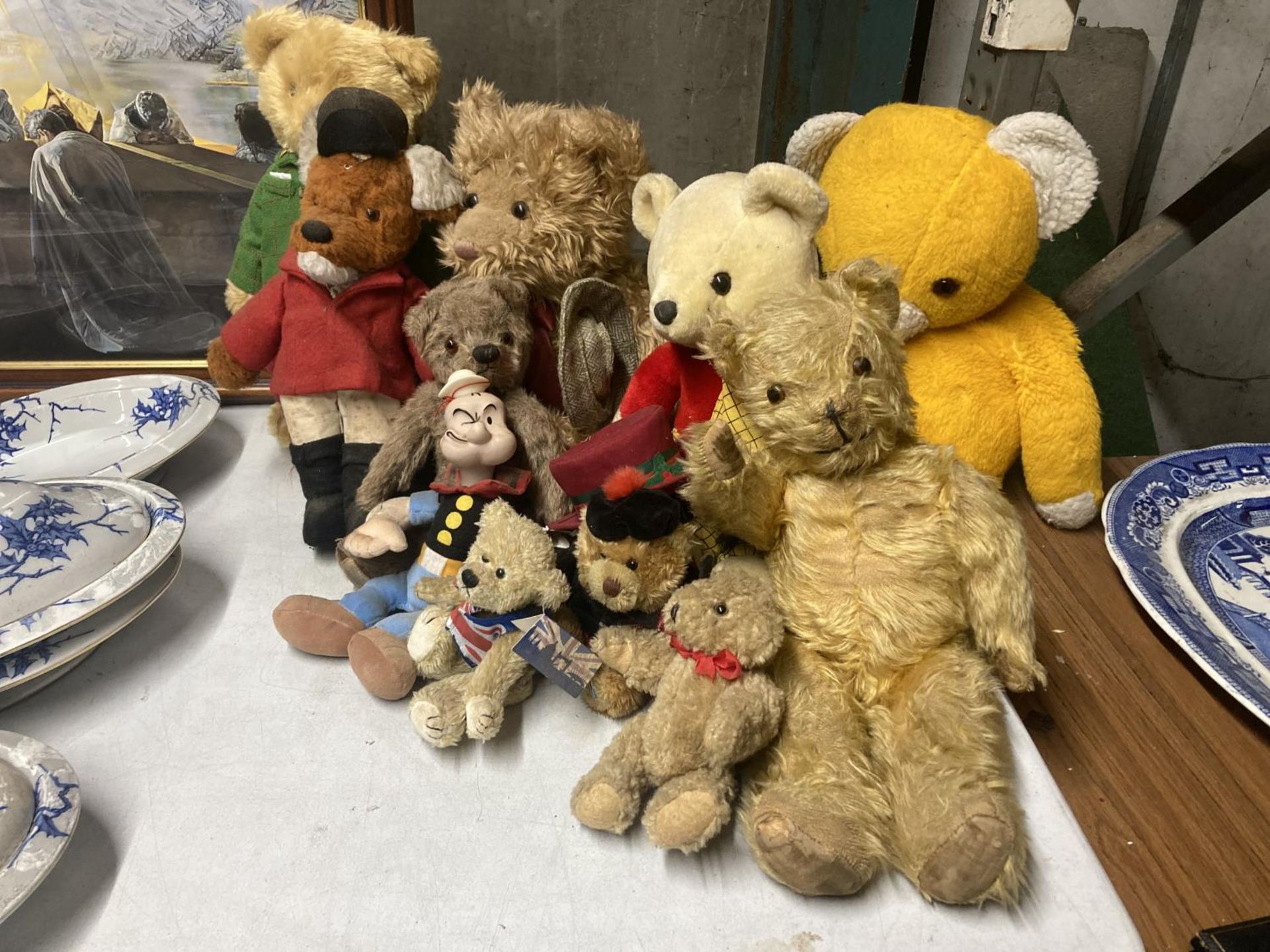 A LARGE QUANTITY OF VINTAGE TEDDY BEARS TO INCLUDE RUPERT THE BEAR, BASIL BRUSH, ETC