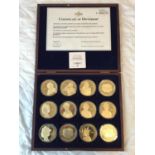 A BOXED PORTRAITS OF THE QUEEN OVERSIZE COMMEMORATIVE COIN COLLECTION WITH C.O.A.