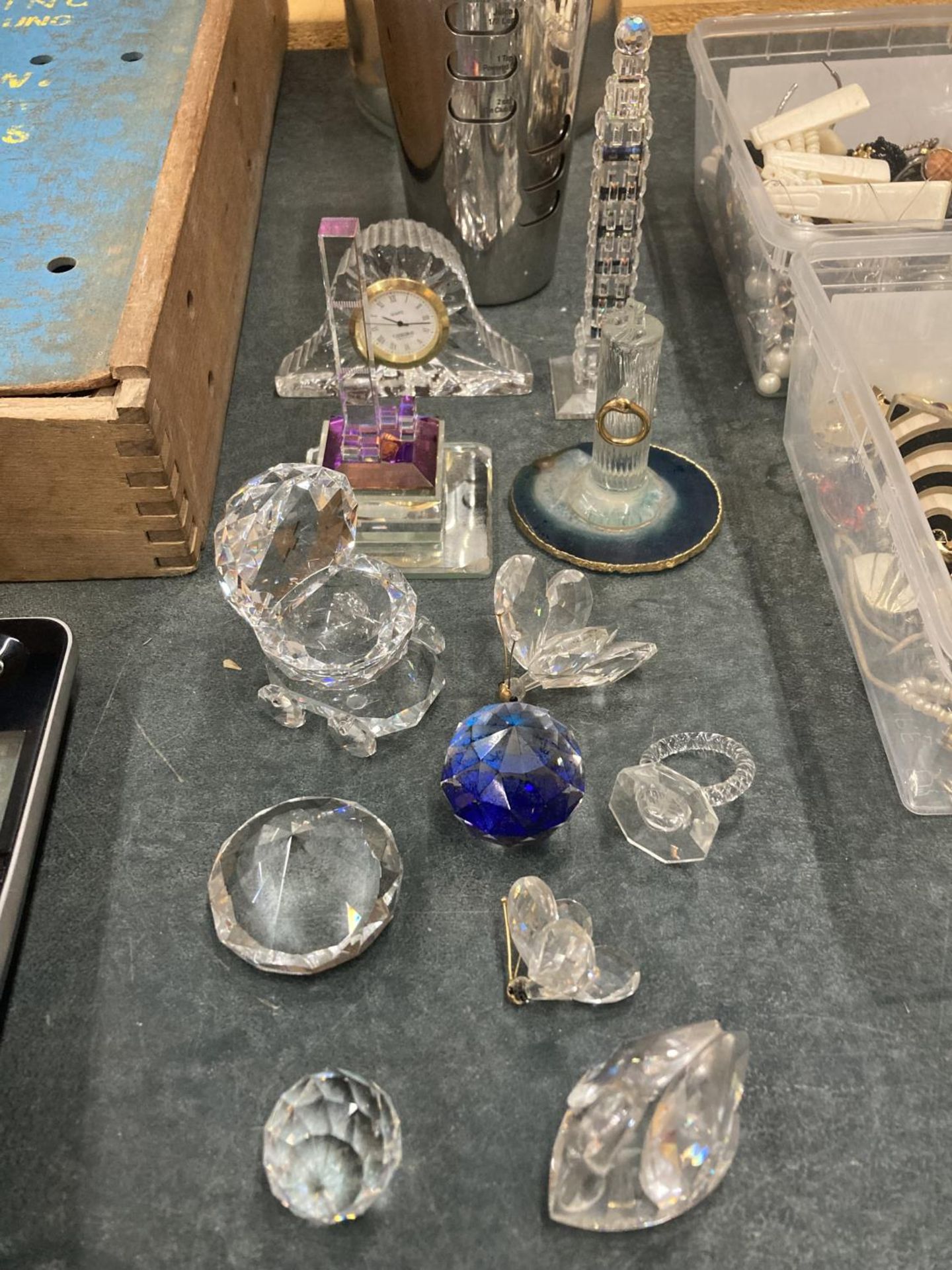 A COLLECTION OF CRYSTAL ORNAMENTS TO INCLUDE A CLOCK, BUTTERFLIES, A PRAM, SWAN, ETC