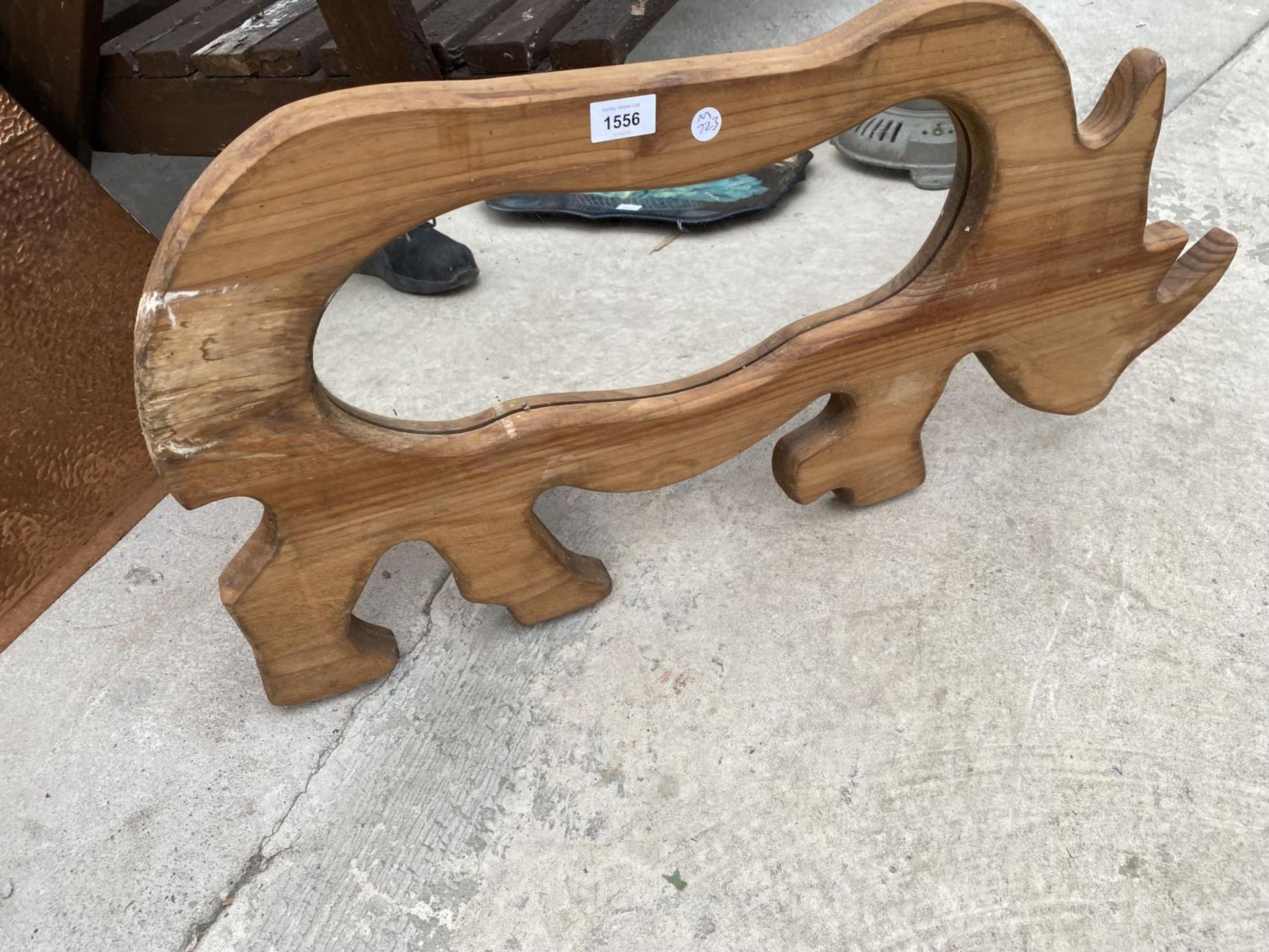 A PINE FRAMED RHINO MIRROR