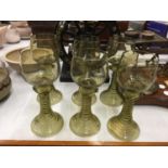 SIX OLIVE GREEN TRUMPET BASED GOBLETS WITH TURNED FOOT CIRCA 1900 - 2 A/F TO BASE, RESTORED WITH