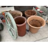 THREE LARGE TERRACOTTA PLANTERS, A CHIMNEY POIT AND A CART WHEEL