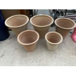 A SET OF FIVE AS NEW GRADUATED TERRACOTTA PLANTERS