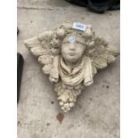 A RECONSTITUTED STONE WALL HANGING CHERUB POCKET PLANTER