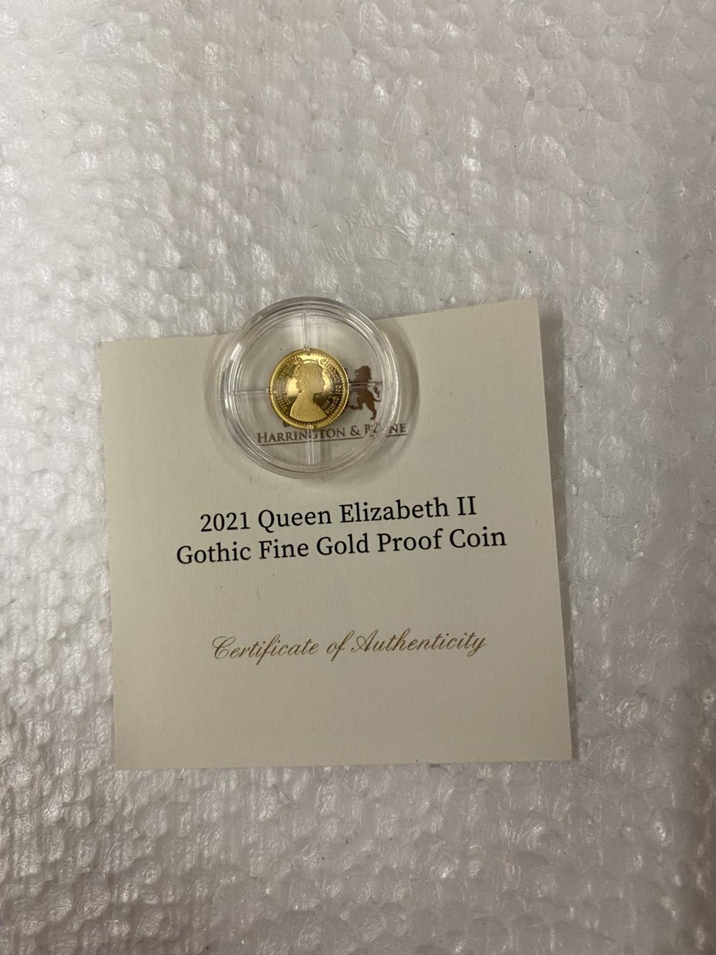 ALDERNEY , CI “2021 QE11 GOTHIC” 24 CARAT GOLD PROOF COIN WITH COA. THE COIN WEIGHS 0.5 GRAMS - Image 2 of 3