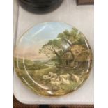 A COALPORT CHARGER WITH AN IMAGE OF GRAZING SHEEP DIAMETER 31.5 CM