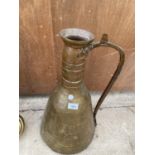 A LARGE MIDDLE EASTERN STYLE COPPER JUG