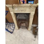 A VINTAGE CAST IRON FIRE PLACE WITH GRATE