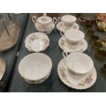 A COLLECTION OF ROYAL ALBERT 'MOSS ROSE' TO INCLUDE CUPS AND SAUCERS, LIDDED SUGAR BOWL, SUGAR