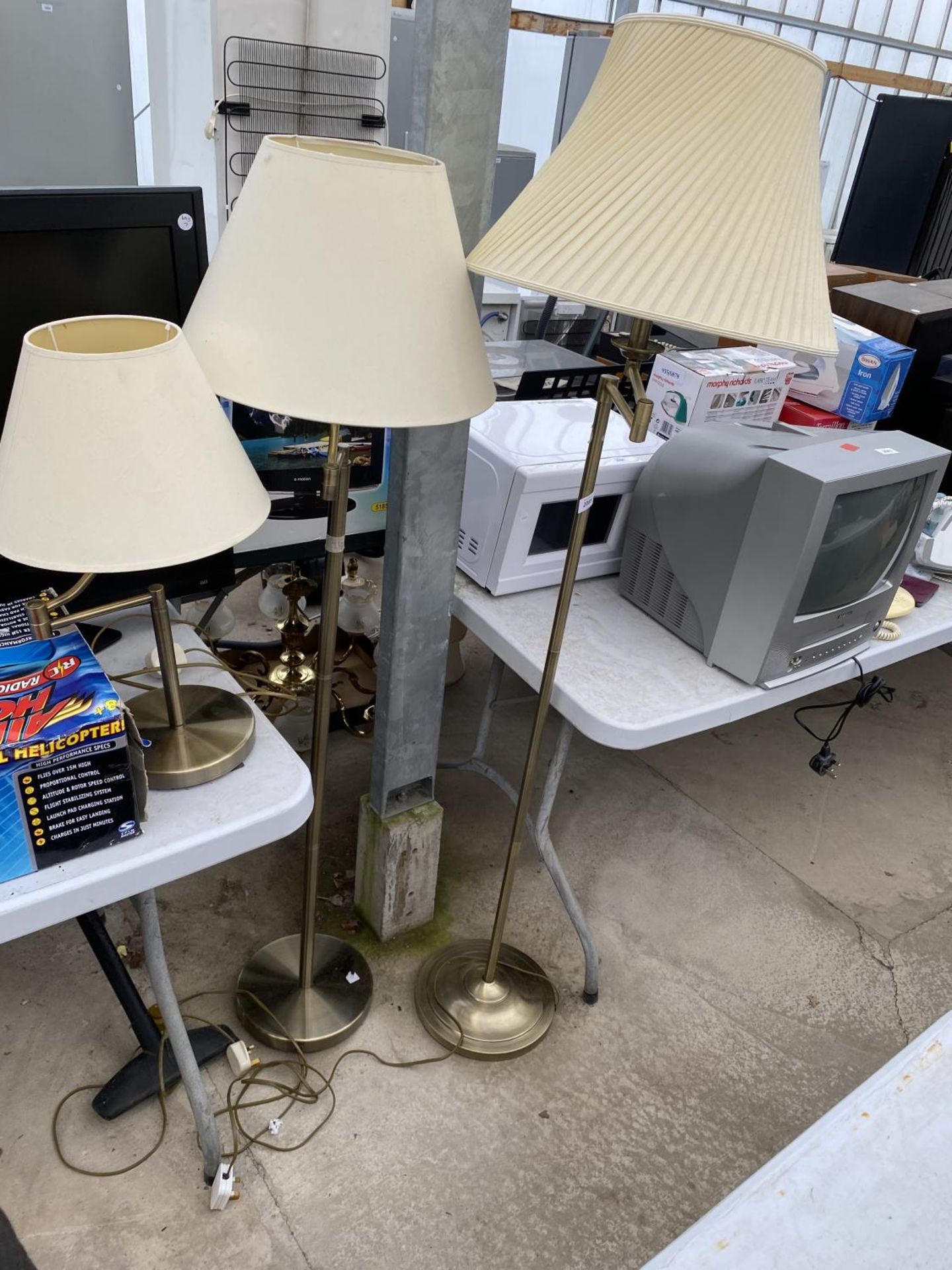 A PAIR OF MODERN METALWARE ADJUSTABLE READING LAMPS AND A TABLE LAMP