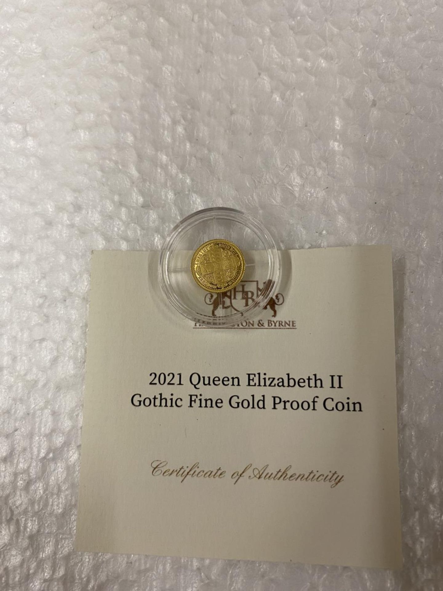 ALDERNEY , CI “2021 QE11 GOTHIC” 24 CARAT GOLD PROOF COIN WITH COA. THE COIN WEIGHS 0.5 GRAMS - Image 3 of 3