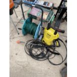 AN ASSORTMENT OF ITEMS TO INCLUDE A KARCHER K2 COMPACT PRESSURE WASHER AND A HOSE REEL ETC