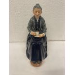 A ROYAL DOULTON FIGURE A CUP OF TEA HN 2322