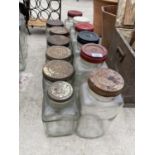 AN ASSORTMENT OF GLASS SWEET JARS WITH SCREW ON LIDS