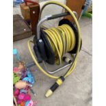 A GARDEN HOSE WITH REEL