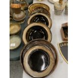 A QUANTITY OF STUDIO POTTERY BOWLS AND PALTES WITH A BROWN GLAZE