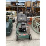 A QUADTRAK 45 SELF PROPELLED PETROL LAWN MOWER WITH GRASS BOX