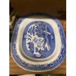 A VICTORIAN BLUE AND WHITE WILLOW PATTERN PLATTER 54CM X 43CM