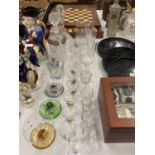 A QUANTITY OF GLASSES TO INCLUDE TWO DECANTERS, DESSERT BOWLS, CHAMPAGNE FLUTES, SHERRY GLASSES, '