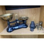 A SET OF LIBRA SCALE CO. KITCHEN BALNACE SCALES WITH CAST IRON AND BRASS BELL WEIGHTS