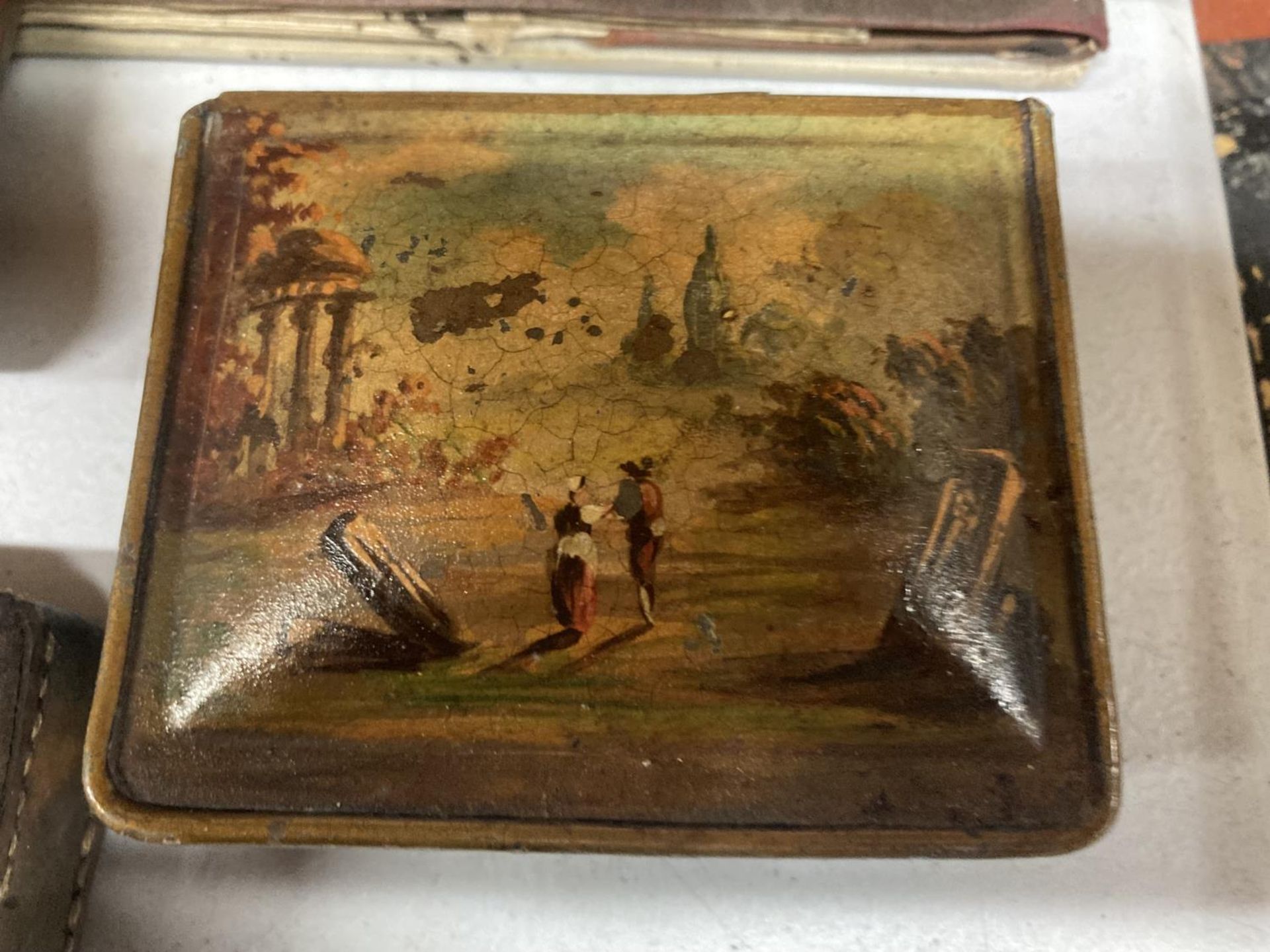 A VINTAGE LEATHER BOUND BLOTTER PAD, TWO METAL BOX ES, ONE WITH A PAINTED TOP, THE OTHER HAVING AN - Image 3 of 4