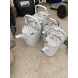 FOUR METAL WATERING CAN PLANTERS