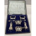 A HALLMARKED BIRMINGHAM SILVER DOUBLE CRUET SET WITH TWO PEPPER POTS, TWO SALTS WITH BLUE GLASS