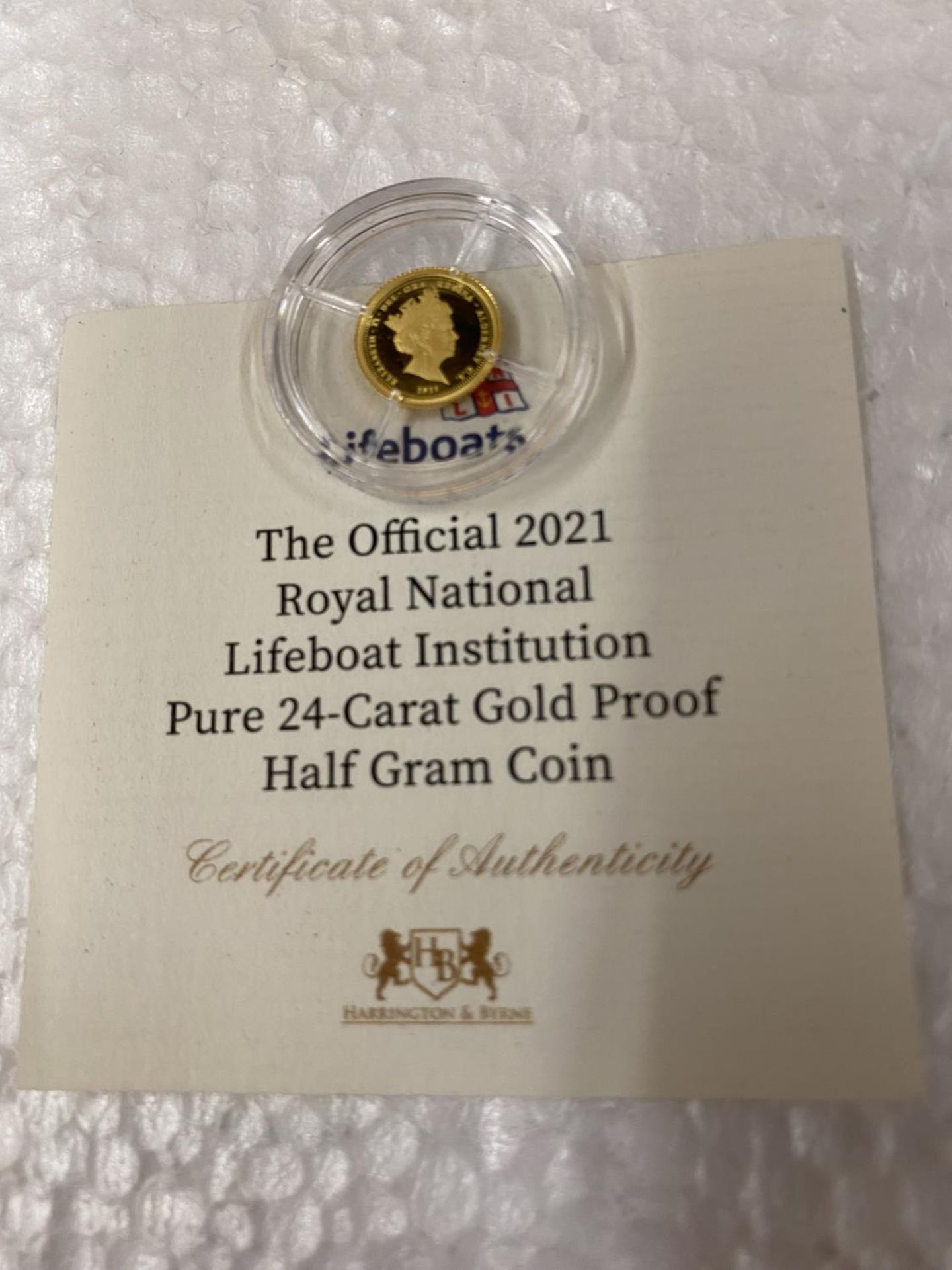 ALDERNEY , CI “THE OFFICIAL 2021 RNLI” A 24 CARAT GOLD PROOF COIN WITH COA . THE COIN WEIGHS 0.5 - Image 2 of 3