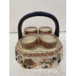 A VINTAGE IMARI STYLE STAND WITH FOUR EGG CUPS