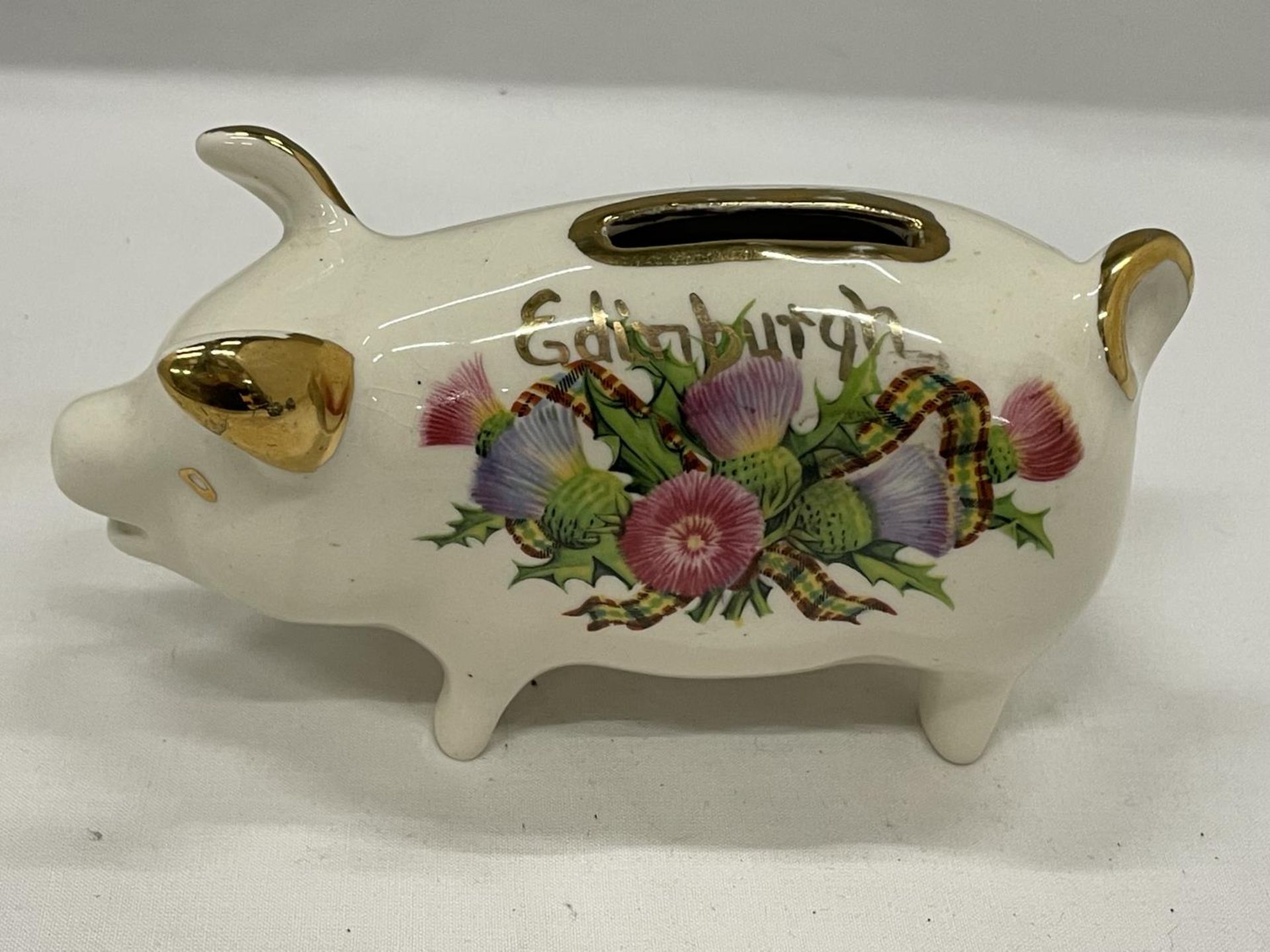 A VINTAGE WEST HIGHLAND POTTERY SOUVENIR EDINBURGH PIGGY BANK