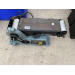 AN ELECTRIC DELTA BELT SANDER