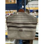 A CHECKED SUIT CARRIER MADE BY ANTLER