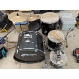 A TIGER DRUM KIT WITH BASE DRUM, SYMBOLS, SNARE AND DRUM STICKS ETC