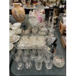 A LARGE QUANTITY OF GLASSWARE TO INCLUDE GLASSES, CLOCKS, SHIPS, ANIMALS, BELLS, ETC